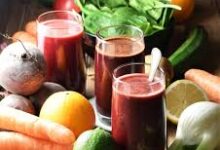 Fresh fruit and vegetable juices with carrots, beets, and green apples