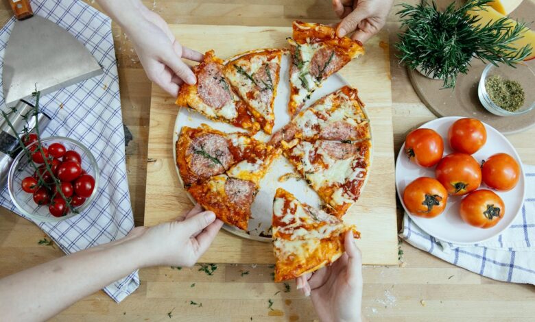 A side-by-side view of traditional pepperoni pizza and gourmet pizza with exotic toppings like duck and arugula